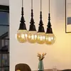Image de Lucande Gesja suspension 4 lampes allongée noire