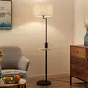 Image de Lindby lampadaire Zinia, noir, tablette, prise USB