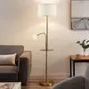 Image de Lindby Lampadaire Aovan, couleur bronze, tablette, port USB