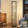 Image de Lindby lampe sur pied Tiliane, noir, métal, 3 lampes, 153cm