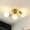 Image de Lindby plafonnier Ciala, 3 lampes, couleur laiton, verre