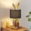 Image de Lampe de table Lindby Lorentina, hauteur 57 cm, lapin, doré, textile
