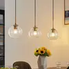 Image de Lindby suspension Grady, laiton/clair, 110 cm, métal, verre
