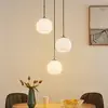 Image de Lindby Suspension Jurian, Ø 32 cm, 3 lampes, nickel/opal, verre