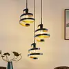 Image de Lindby Colten suspension, Ø 50 cm, 3 lampes, noir, or