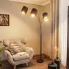 Image de Lindby lampe sur pied Nanika, noir/or, 202 cm, E27, 3 lampes