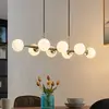 Image de Lindby suspension Kiamo, 83 cm, laiton, blanc, verre, G9