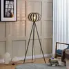 Image de Lindby lampadaire Tamira, noir, rotin, hauteur 143 cm, E27