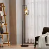 Image de Lindby lampadaire Nimbora, 150 cm, noir, verre, métal