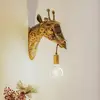 Image de Applique murale Lindby Nirvathia, 35 cm, girafe, couleur laiton