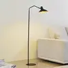 Image de Lindby lampe sur pied Adrik, noir, métal