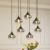 Image de Lucande, suspension Jarven, à 7 lampes, noir, verre