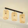 Image de Lucande plafonnier Jorick, 3 lampes, longueur 104,5cm, bambou