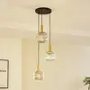 Image de Lindby, suspension Doroteo, à 3 lampes, vert/ambre/gris, verre