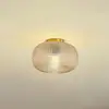 Image de Lindby Plafonnier Hildur, Ø 25 cm, ambre, verre
