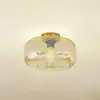 Image de Lindby Plafonnier Hildur, Ø 28,5 cm, ambre, verre