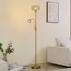 Image de Lindby lampe sur pied Aliette, or/ambre, verre, lampe de lecture