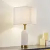 Image de Lampe de table Lindby albâtre, blanc/or, Ø 30 cm, marbre, E27