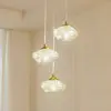 Image de Lindby Suspension Piatra, Ø25cm, 3 lampes, cognac/laiton, verre