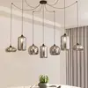 Image de Lindby suspension Marla, 7 lampes, verre, gris fumé, 128cm