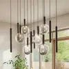 Image de Suspension Lucande Lumavia, à 12 lampes, verre, noir/transparent, G9