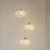 Image de Suspension Lindby Piatra, Ø 25 cm, à 3 lampes, opale/laiton, verre