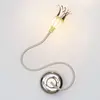 Image de Serien Lighting Applique Poppy dont les pétales s'épanouissent