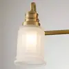 Image de QUOIZEL Applique murale Swell IP44, à 4 lampes, laiton brossé