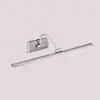 Image de Searchlight Applique LED à tableau Head, finition nickel