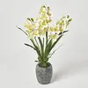 Image de HOMESCAPES Grande Orchidée Artificielle Jaune en Pot foncé en Ciment, Fleurs artificielles déco 82 cm