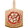 Image de Pelle à pizza en bambou 30,5cm Ooni. À la fois pelle a pizza et planche à découper, elle est idéale pour votre four a pizza!