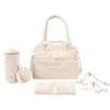 Image de doomoo Sac à langer Bebe Fluffy - Grande Contenance de 24L - Rangements Modulables - Pochette Amovible - 8 Accessoires Bébé Inclus Dont Matelas à Langer, Housse Isotherme et Attaches Poussettes, Beige