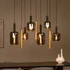 Image de Lucide Suspension Joanet, longueur 130 cm, fumé/laiton, verre, à 9 lampes.