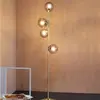Image de Dyberg Larsen Como lampe sur pied, 4 lampes, laiton