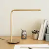 Image de UMAGE lampe de table LED Omni, laiton hauteur 46 cm métal pivotant