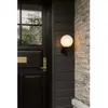 Image de Nuura Aps Applique murale d'extérieur Nuura Miira, Ø 20 cm, noir/opale