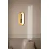 Image de Nuura Aps Applique murale LED Nuura Sasi, hauteur 65 cm, couleur laiton, métal