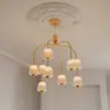 Image de Nuura Aps Lustre LED Nuura Asteea 9, Ø 66 cm, couleur laiton/transparent