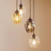 Image de EMIBIG LIGHTING Suspension Starla ronde à 4 lampes graphite/ambre/clair