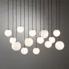 Image de Euluna Suspension SNOWBALL, verre opale/noir, 100 x 34 cm, 14 x G9