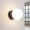 Image de SOLLUX LIGHTING Applique murale You, noir, Ø 12 cm, acier/verre