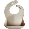 Image de mushie Bavoir en silicone pour bébé - Sable - Réglable - Imperméable