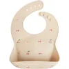 Image de mushie Bavoir Bébé en Silicone | Bavoirs Imperméables Réglables | Bavoirs Faciles à Essuyer | 4 Tailles Réglables Avec Poches Avant Profondes | 100% Sans BPA et Phtalate | Cherries