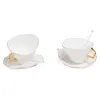 Image de Seletti Tasse à thé en porcelaine fondue, soucoupe et cuillère, ensemble de 2 pièces