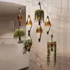 Image de kdln Suspension LED Viceversa, verre ambre, à 1 lampe