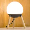 Image de FARO BARCELONA Lampe de table Mine, trépied, bois, verre, hauteur 30 cm