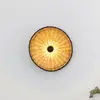 Image de FARO BARCELONA Applique murale Costas, noir/bois clair, rotin, Ø 40 cm