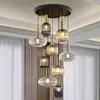 Image de Schuller Valencia Suspension Norma, Ø 80 cm, à 9 lampes, noir/laiton, verre