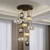 Image de Schuller Valencia Suspension Norma, à intensité variable, à 9 lampes, télécommande, noir/laiton