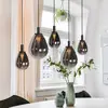 Image de Mexlite Suspension LED Glimsy, 115 cm, verre noir/gris fumé, à 5 lampes.